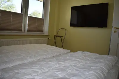 Ein Bett oder Betten in einem Zimmer der Unterkunft Haus zum Strand Muschel