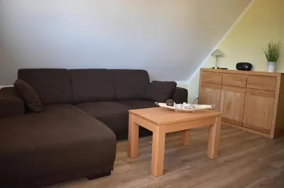 Ein Sitzbereich in der Unterkunft Haus zum Strand Muschel
