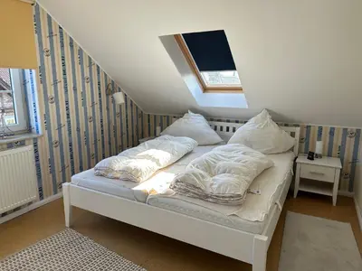 Ein Bett oder Betten in einem Zimmer der Unterkunft Seebär