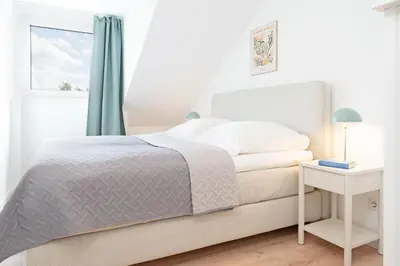 Ein Bett oder Betten in einem Zimmer der Unterkunft Strandloiper