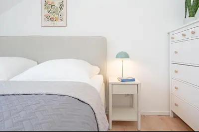 Ein Bett oder Betten in einem Zimmer der Unterkunft Strandloiper
