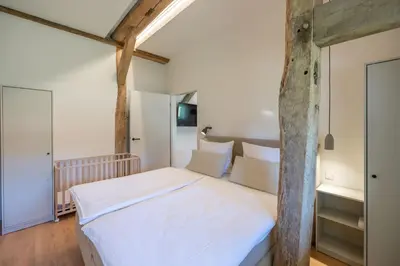 Ein Bett oder Betten in einem Zimmer der Unterkunft Reethus 22 Loft 3