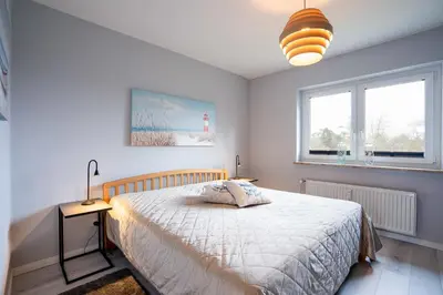 Ein Bett oder Betten in einem Zimmer der Unterkunft FeWo Kleiner Knurrhahn - strandnah - ein kleiner Hund willkommen