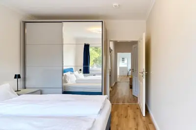 Ein Bett oder Betten in einem Zimmer der Unterkunft Perle Timmendorfer Strand