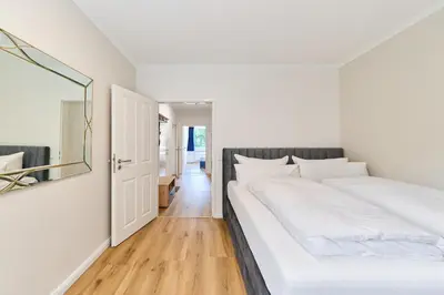 Ein Bett oder Betten in einem Zimmer der Unterkunft Perle Timmendorfer Strand