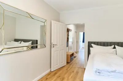 Ein Bett oder Betten in einem Zimmer der Unterkunft Perle Timmendorfer Strand