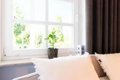 Ein Bett oder Betten in einem Zimmer der Unterkunft Ferienwohnung Kleine Möwe Haffkrug