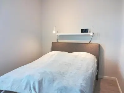 Ein Bett oder Betten in einem Zimmer der Unterkunft Fewo Seelöwe Haffkrug Strandallee 88 b