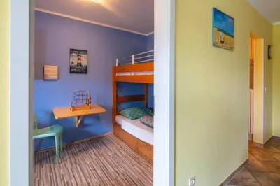 Ein Bett oder Betten in einem Zimmer der Unterkunft Fewo Sorgenfrei Kammerweg 89 i Scharbeutz