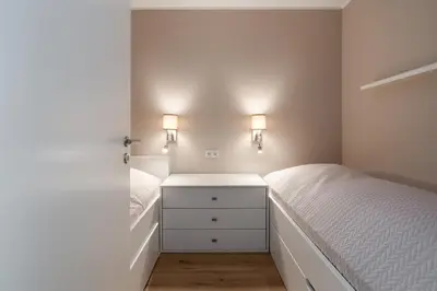 Ein Bett oder Betten in einem Zimmer der Unterkunft Ferienpark Sierksdorf App 185