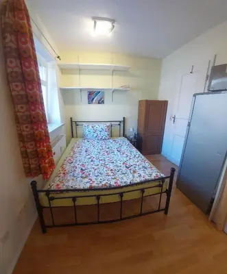 Ein Bett oder Betten in einem Zimmer der Unterkunft Wo die Fledermaus fliegt