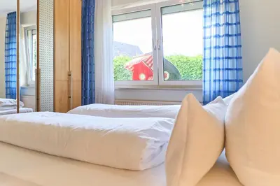 Ein Bett oder Betten in einem Zimmer der Unterkunft Wiesenweg 5 Apt 3