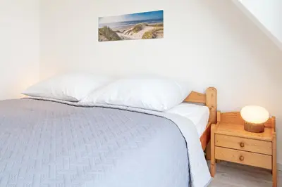 Ein Bett oder Betten in einem Zimmer der Unterkunft Strandschlösschen 31