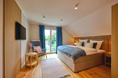 Ein Bett oder Betten in einem Zimmer der Unterkunft Lykke Hus - Wohnung Fridas Ausblick OG