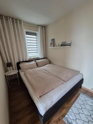 Ein Bett oder Betten in einem Zimmer der Unterkunft Ferienwohnung bei Lübeck
