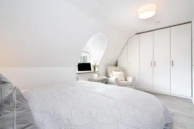 Ein Bett oder Betten in einem Zimmer der Unterkunft Chic & Kuschelig App 5