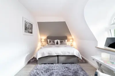 Ein Bett oder Betten in einem Zimmer der Unterkunft Chic & Kuschelig App 5
