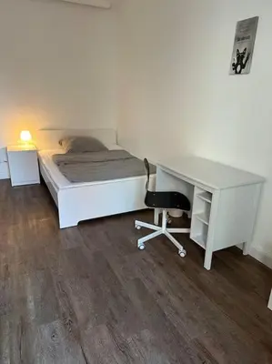 Ein Bett oder Betten in einem Zimmer der Unterkunft Charmante Wohnung in Uni Nähe