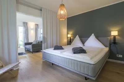 Ein Bett oder Betten in einem Zimmer der Unterkunft Haffperle - Meerblau