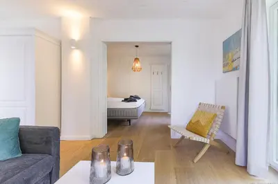 Ein Bett oder Betten in einem Zimmer der Unterkunft Haffperle - Meerblau