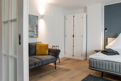 Ein Bett oder Betten in einem Zimmer der Unterkunft Haffperle - Strandgold