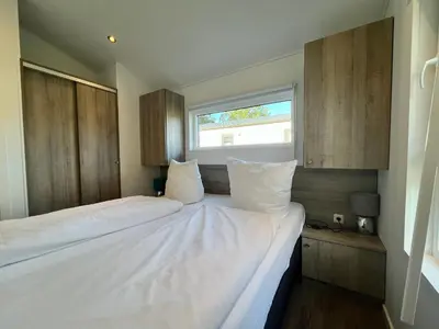 Ein Bett oder Betten in einem Zimmer der Unterkunft Ostseecamp Spatzennest