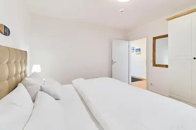 Ein Bett oder Betten in einem Zimmer der Unterkunft Residenz Johannsens Ap B12