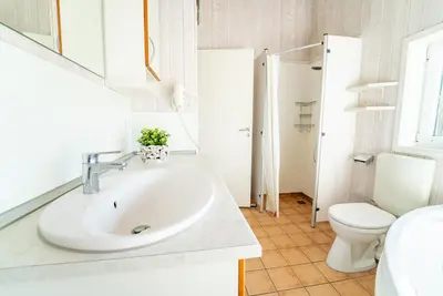 Ein Badezimmer in der Unterkunft Strandblick - Dorf 1 Ferienhaus 18