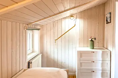 Ein Bett oder Betten in einem Zimmer der Unterkunft Strandblick - Dorf 1 Ferienhaus 16