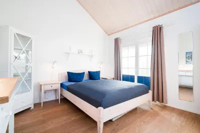 Ein Bett oder Betten in einem Zimmer der Unterkunft Strandpark Sierksdorf H047