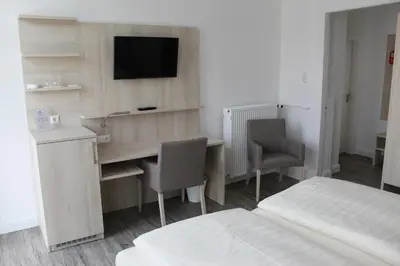 Ein Bett oder Betten in einem Zimmer der Unterkunft Hotel Sonnenklause