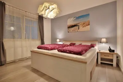 Ein Bett oder Betten in einem Zimmer der Unterkunft Haus Strandstrasse Strandstrasse 150 Haus B Appartement 5