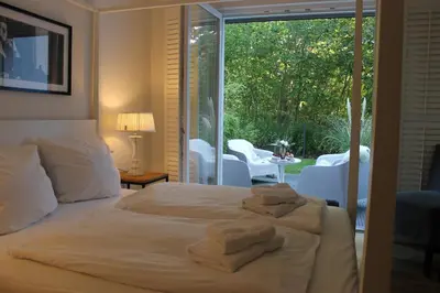 Ein Bett oder Betten in einem Zimmer der Unterkunft Ferienwohnung Alter Sandweg inklusive Strandkorb