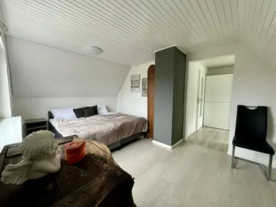 Ein Bett oder Betten in einem Zimmer der Unterkunft Ferienhaus Achterhus für Familien & Homeoffice