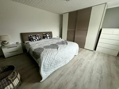 Ein Bett oder Betten in einem Zimmer der Unterkunft Ferienhaus Achterhus für Familien & Homeoffice