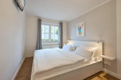 Ein Bett oder Betten in einem Zimmer der Unterkunft Ferienwohnung Robbe Timmendorfer Strand