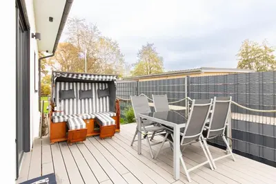 Ein Balkon oder eine Terrasse in der Unterkunft Ferienhaus Admirals Huus Niendorf