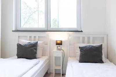 Ein Bett oder Betten in einem Zimmer der Unterkunft Ferienhaus Admirals Huus Niendorf