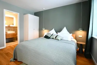 Ein Bett oder Betten in einem Zimmer der Unterkunft Schöne Aussicht Rosenhagen Haus 5