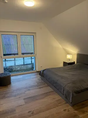 Ein Bett oder Betten in einem Zimmer der Unterkunft OstseeLiebe