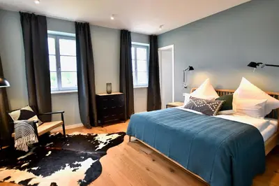 Ein Bett oder Betten in einem Zimmer der Unterkunft Schöne Aussicht Rosenhagen Haus 6