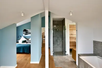 Ein Bett oder Betten in einem Zimmer der Unterkunft Schöne Aussicht Rosenhagen Haus 6