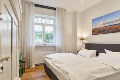 Ein Bett oder Betten in einem Zimmer der Unterkunft Villa Daheim Travemünde