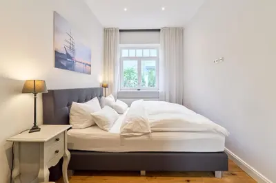 Ein Bett oder Betten in einem Zimmer der Unterkunft Villa Daheim Travemünde