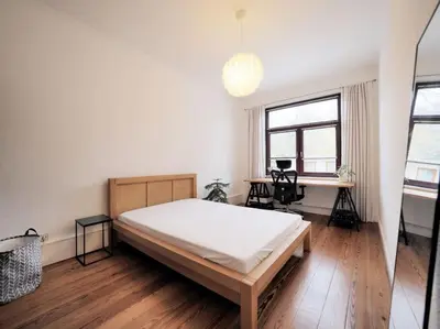 Ein Bett oder Betten in einem Zimmer der Unterkunft Altbauwohnung im Herzen Lübecks