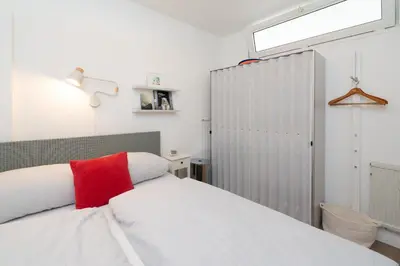 Ein Bett oder Betten in einem Zimmer der Unterkunft Schatz am Strand - App 103