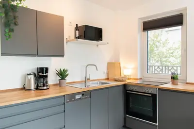 Küche/Küchenzeile in der Unterkunft Ferienwohnung Wellenbrecher Niendorf
