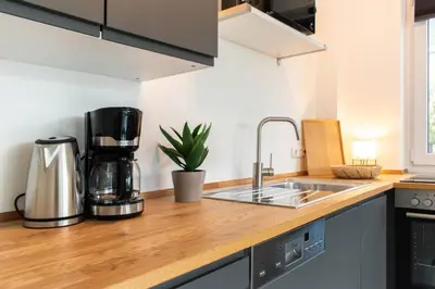 Küche/Küchenzeile in der Unterkunft Ferienwohnung Wellenbrecher Niendorf