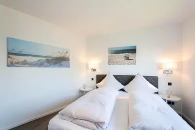 Ein Bett oder Betten in einem Zimmer der Unterkunft Ferienwohnung Hummer Scharbeutz