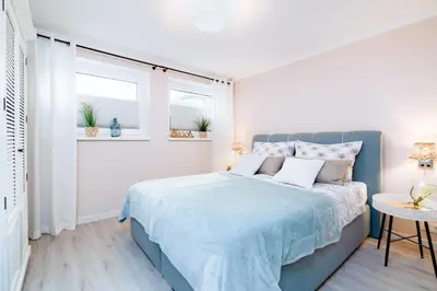 Ein Bett oder Betten in einem Zimmer der Unterkunft Pier One
